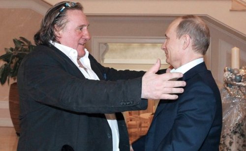 (pool photo)GD embraces Putin, leader of his "adoptive" country -- or is he evaluating Putin as a possible hors d'oeuvre?